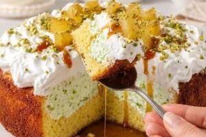 Delicious Pineapple Paradise Cake topped with fresh pineapple and coconut flakes