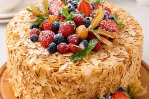 Delicious Almond Berry Crunch Cake topped with fresh berries and almond slices.