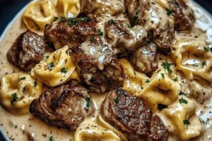 Delicious Cracked Garlic Steak Tortellini served in creamy sauce.