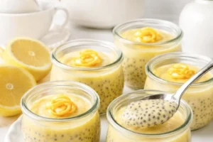 Creamy Lemon Chia Seed Pudding in a glass topped with lemon slices