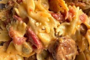 Delicious creamy pasta served in a bowl, garnished with fresh herbs