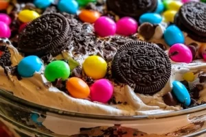 Easter Dirt Cake Casserole with chocolate and colorful toppings
