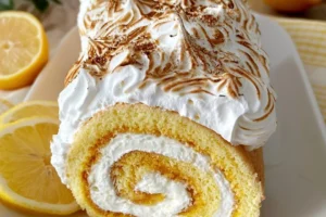Lemon Meringue Swiss Roll Cake with meringue topping and lemon filling