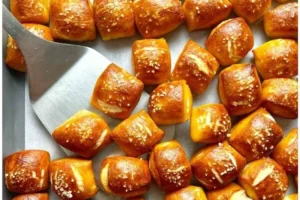 Bowl of warm soft pretzel bites with dipping sauce