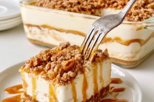 Creamy Lotus Biscoff dessert served in a glass with cookie crumble on top