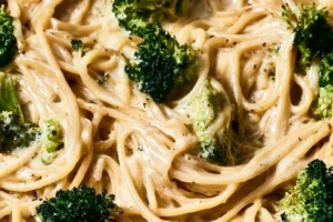 Bowl of healthy creamy chicken alfredo topped with parsley