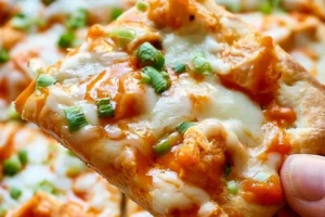 High-Protein Buffalo Chicken Flatbread topped with fresh ingredients