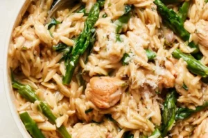 Protein-packed chicken orzo dish with vegetables served in a bowl