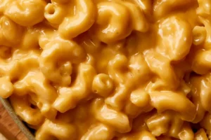 Creamy cottage cheese mac and cheese served in a bowl, garnished with herbs