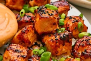 Air Fryer salmon bites served with Bang Bang sauce