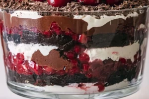 Delicious Black Forest Trifle dessert with layers of chocolate, cherries, and whipped cream.