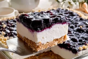 A delicious Blueberry Dream Tart topped with fresh blueberries and a creamy filling.