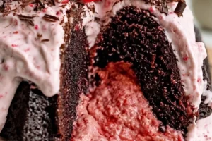Delicious creamy Chocolate Strawberry Bundt Cake with fresh berries and chocolate glaze.