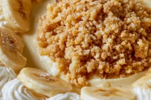 No-Bake Banana Pudding Cheesecake topped with banana slices and whipped cream