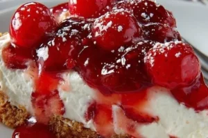 No-bake strawberry cheesecake topped with fresh strawberries and whipped cream